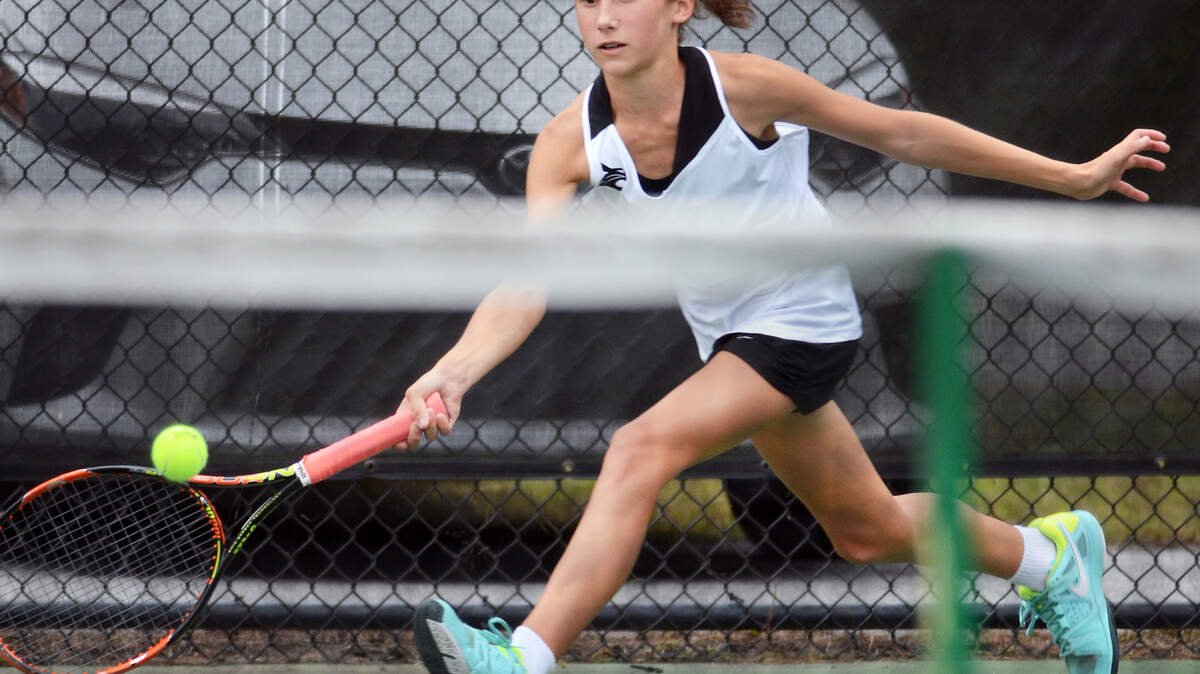 Bluffton No. 1 singles player Natalie Bassett runs down a shot during her singles match with Caitlin Daly as the Bobcats take on James Island in the third round of the Class 4-A playoffs on Wednesday. Bassett, who is a seventh-grader, is 19-0 for the season.