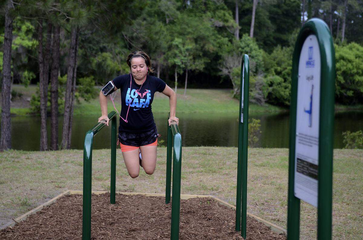 Cindy Garcia, of Bluffton, works out her arms on the newly installed outdoor fitness equipment on Wednesday, May, 14 at Jarvis Creek Park on Hilton Head Island. The equipment was installed by the Hilton Head Island-Bluffton Chamber of Commerce Leadership class as part of their group project. The class also installed similar equipment at Oscar J. Frazier Park in Bluffton so that both communities could benefit from the project.