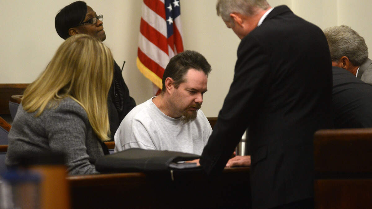 FILE: Walter Glass, center, talks with his defense attorneys before a Nov. 12, 2015, hearing to discuss if he is mentally competent to stand trial for allegedly murdering Melanie Lowther in July 2013.  