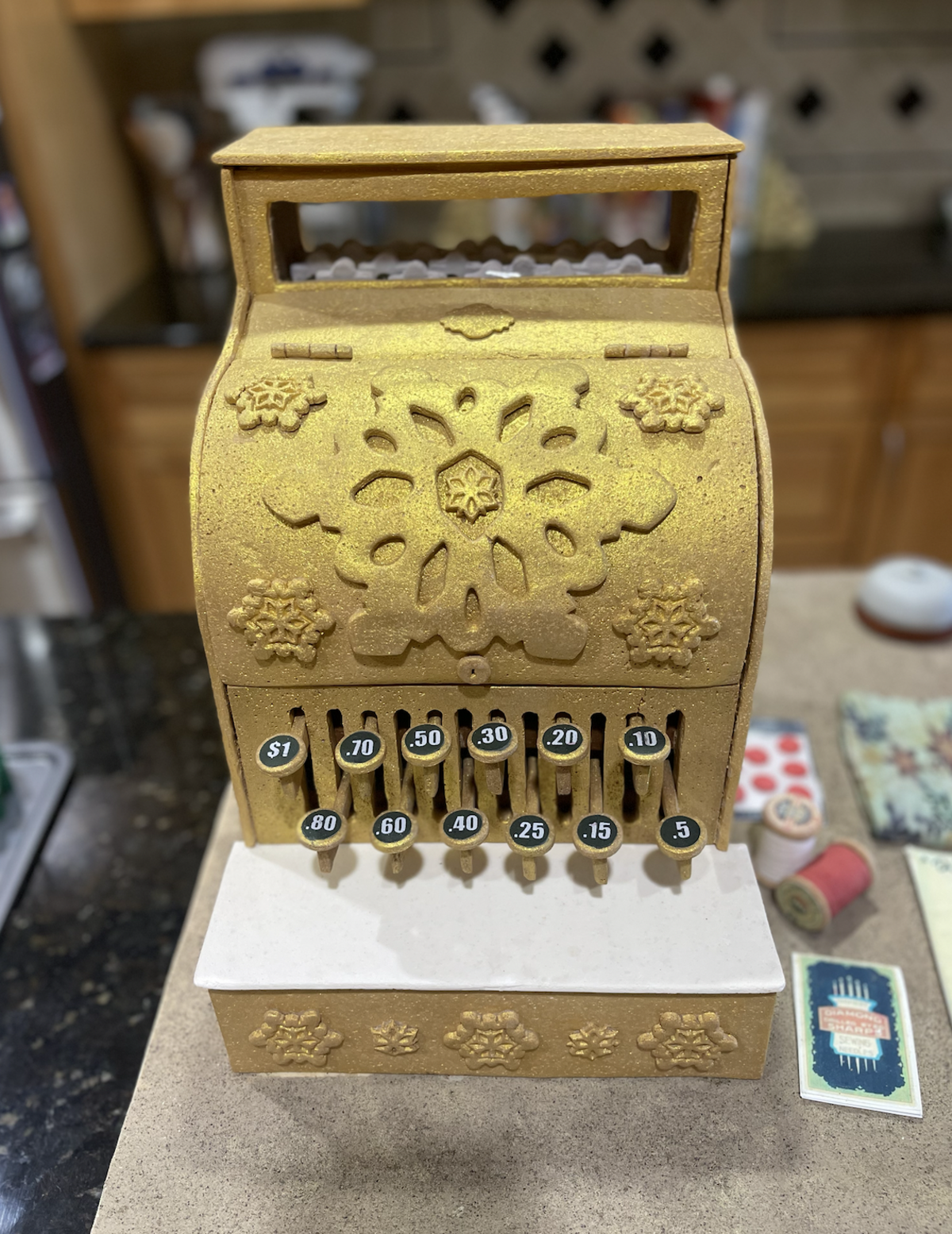 Kelly Clements’ vintage register is crafted entirely of gingerbread. It was the piece that won the 2025 South Carolina Gingerbread House Competition in early December.