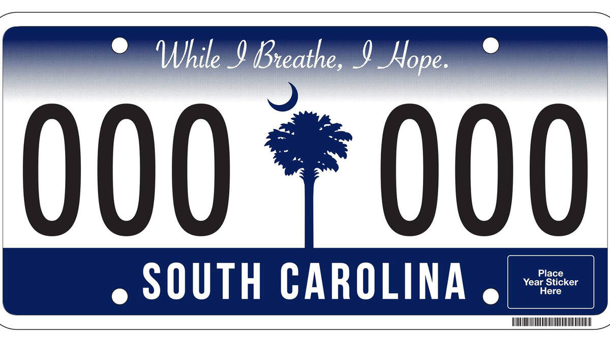 The South Carolina Department of Motor Vehicles (DMV) will begin issuing a new South Carolina license plate and sticker during the next few months. The new license plate reflects a strong South Carolina theme with the palmetto tree and crescent moon in indigo with a white background. The state motto, ?While I Breathe, I Hope,? is at the top of the license plate. ?The motto is significant for South Carolina. The state has proven its resilience this year and become the example for other states,? said Acting Executive Director John Laganelli. DMV will start issuing the new license plates in early 2016. The new plates will have one validation sticker placement area instead of two. The new stickers will have both the month and year, eliminating the need for a month sticker. Switching to a single sticker process will mean a substantial cost savings for the state. DMV will save more than $800,000 during the reissue cycle.