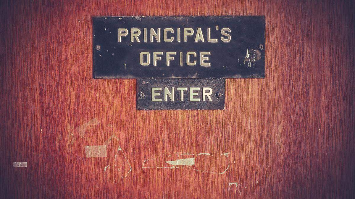 Photo illustration of a principal’s office door.