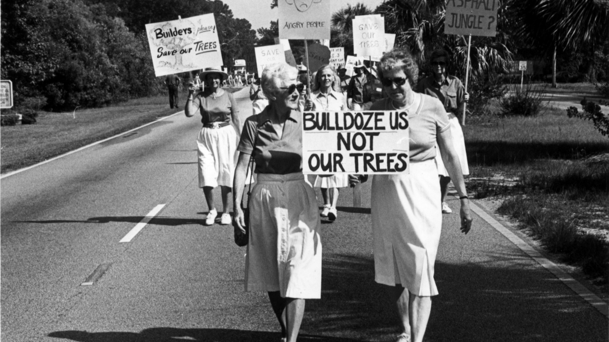 Dorothea Griffin, left, and Katie Callahan lead a march of “Angry People” to save trees on Hilton Head Island on July 14, 1984.