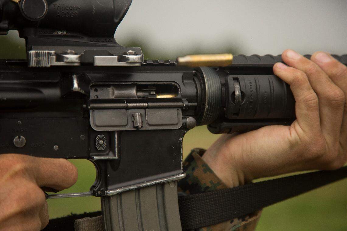 This file photo shows a U.S. Marine Corps trainee firing a M16A4 rifle.