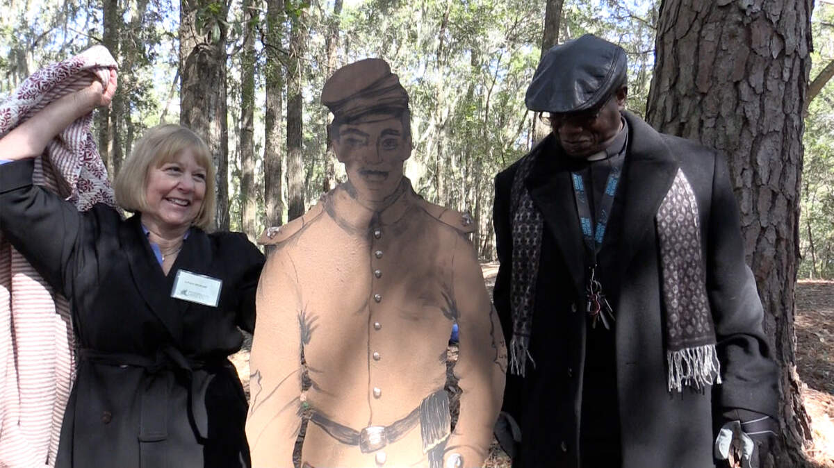 Linda Hyslop, left, president of the Hilton Head Land Trust, and the Rev. Charles Hamilton, pastor of St. James Baptist Church of Mitchelville, unveil a monument Saturday honoring the U.S. 32nd Colored Infantry at Fort Howell.