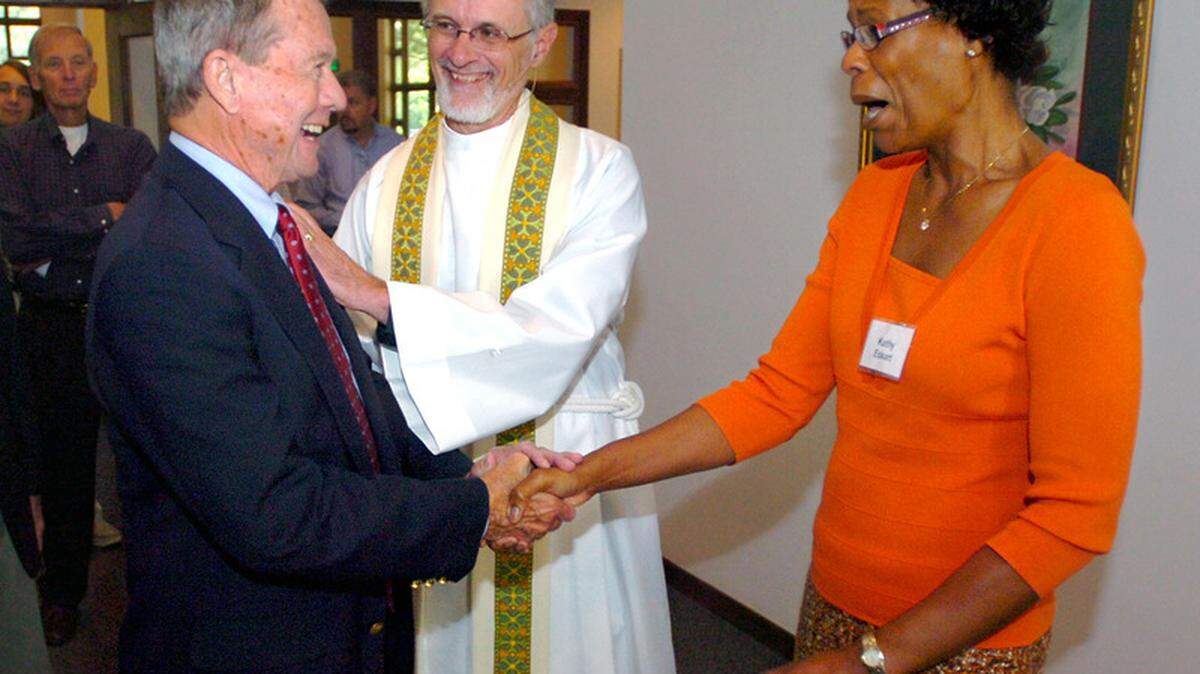 Island Lutheran Church member Roger Jinkins is greeted by the Rev. Lawrence Eckart and his wife, Kathy, on Sunday after a church service on Hilton Head Island.