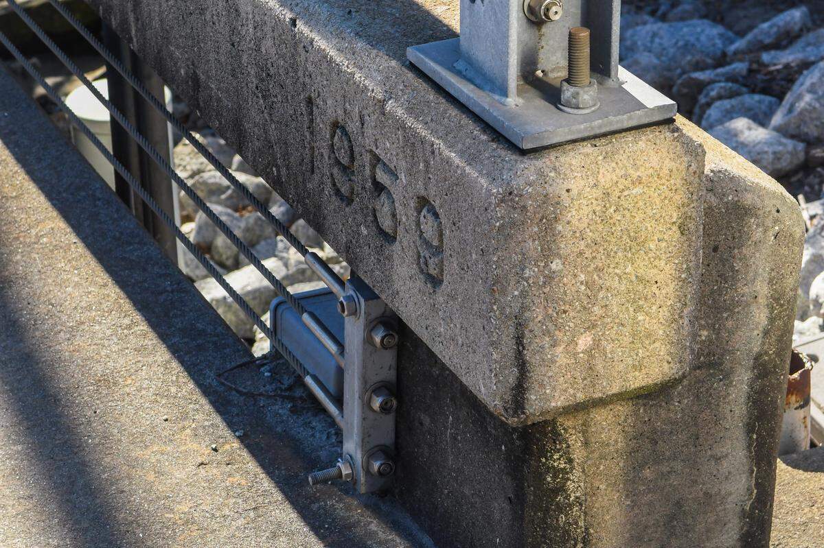 The year of completion is cast into the concrete of the Richard V. Woods Memorial Bridge.