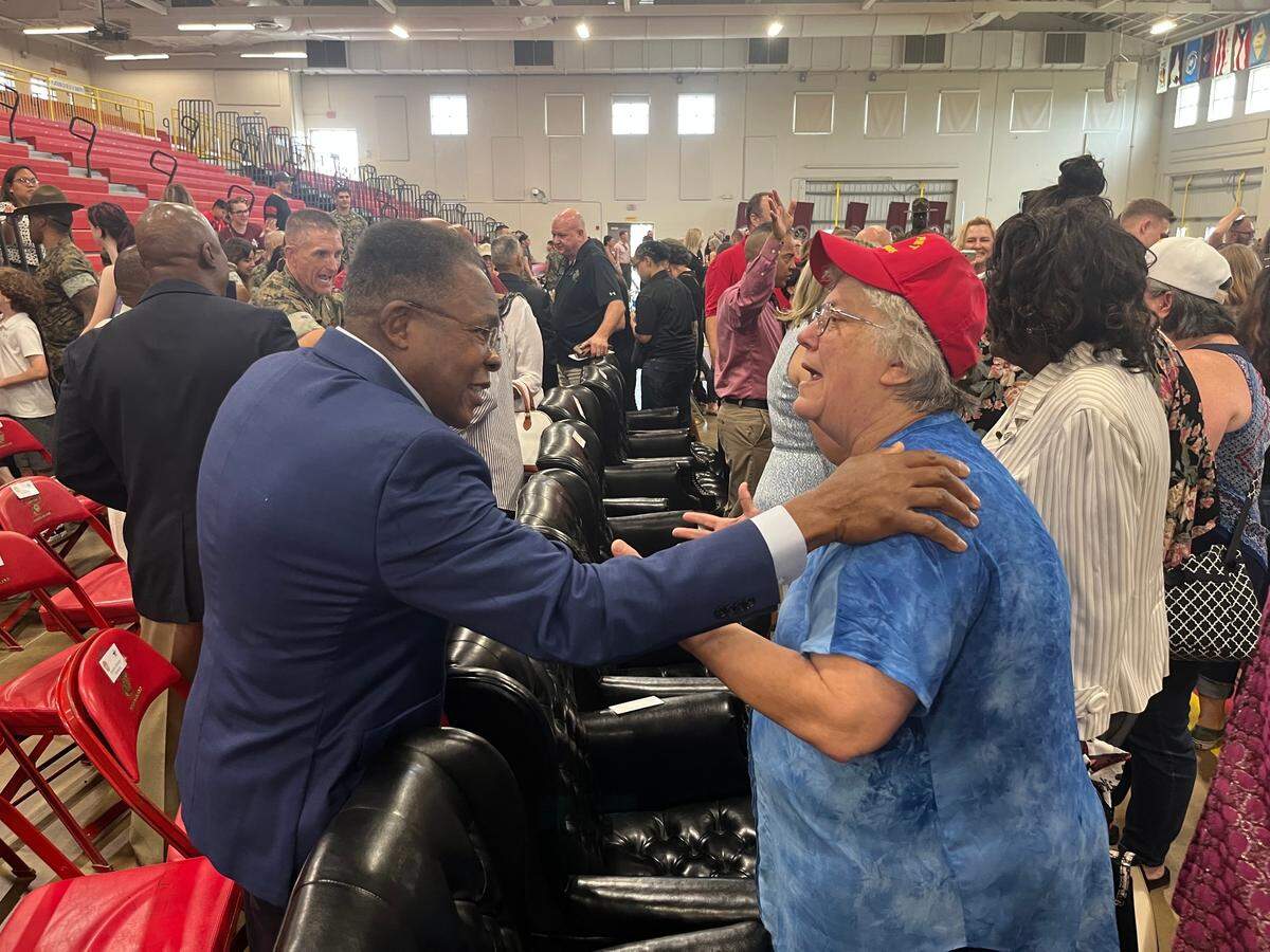 Maggie Hickman, right, of Beaufort, who went through boot camp at Parris Island in the mid-70s, talks with James Moore, former Sgt. Major for the Fourth Recruit Training Battalion, on Thursday. Women were trained at the battalion.