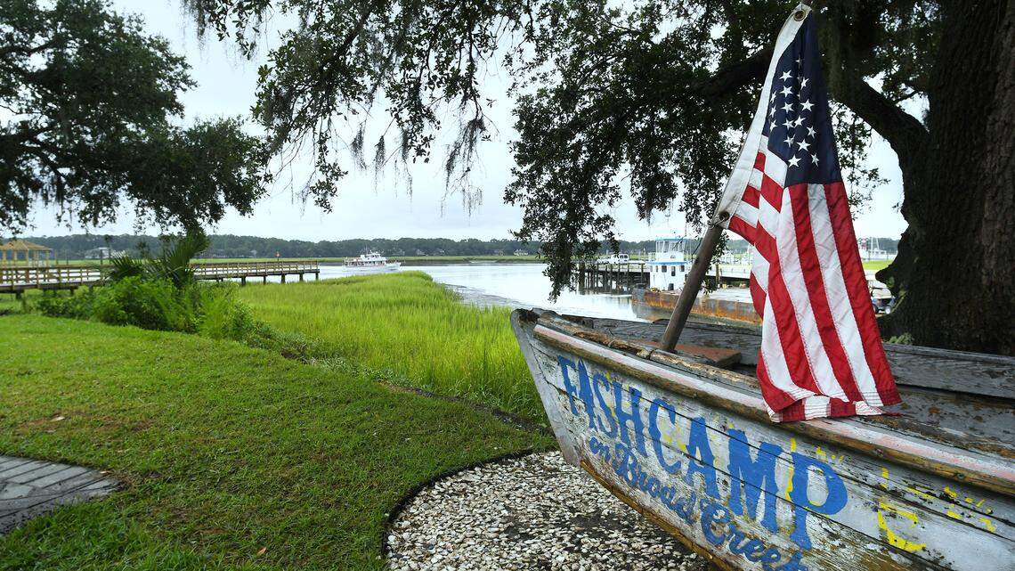You can watch the boats pass by from beneath the shady oaks at Fishcamp on Broad Creek.