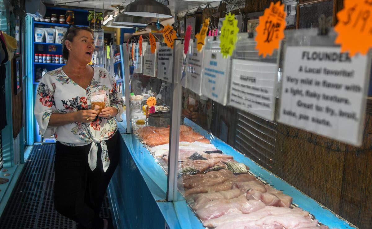 Tonya Hudson, owner of Benny Hudson Seafood Market, reminisces about her father, the namesake of the business, on Friday, March 24, 2023, while talking about a future move that will be five times the size of the existing 900-square-foot seafood market.