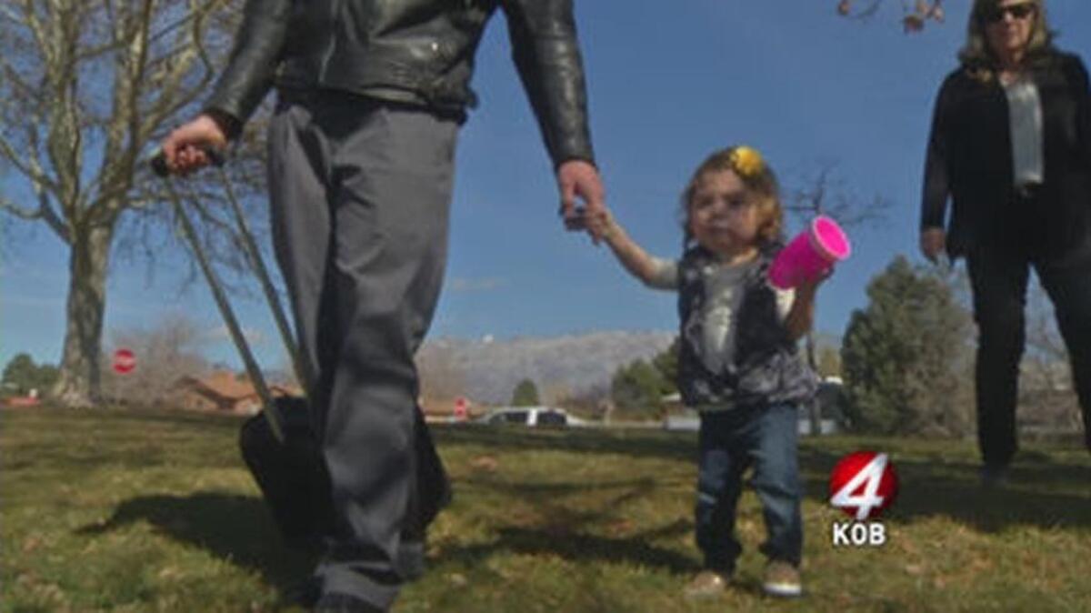 Baby Nichole and her new family: The nurse who cared for and fostered her from infancy in an Alburquerque hospital and her husband.