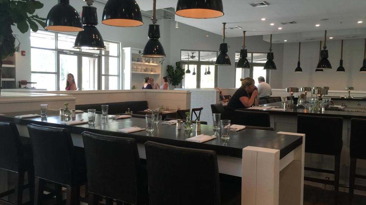 Jane Bistro features seating for groups of two to 20, black concrete countertops and nautical light fixtures to complete a “white and bright” look, according to co-owner Nancy Huber.
