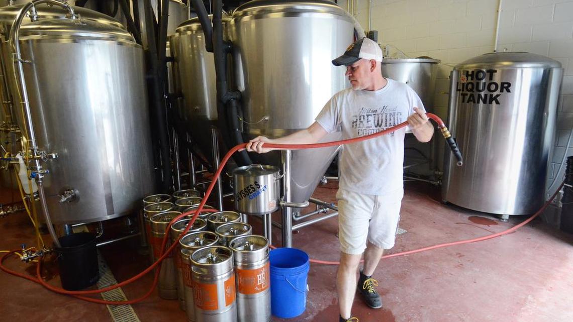 Hilton Head Brewing Company's head brewer John Rybicki is photographed at work on another batch of beer at the company's Cardinal Road production facility.