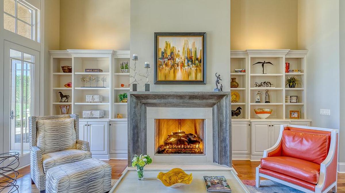 The original mantle in our clients’ home in Wexford on Hilton Head Island was too traditional and fussy for their tastes. This sleek and stunning cast stone mantle and fireplace surround perfectly complements their style and contemporary decor.