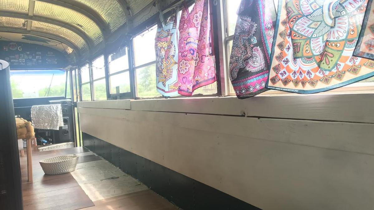 The big blue tarp is gone, letting in lots of light into the bus.
