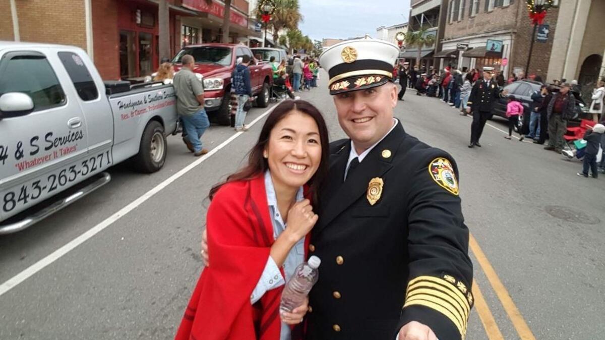 Reece Bertholf takes a selfie at a parade (not the Water Festival) with his wife, Mikie, along the parade route on Bay Street in Beaufort.