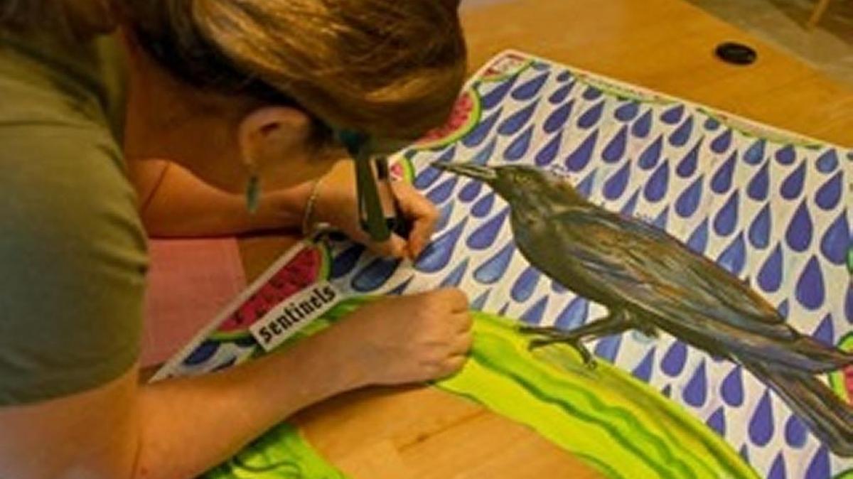 Artist and gallery owner Mira Scott of Hilton Head Island works on a piece of artwork.