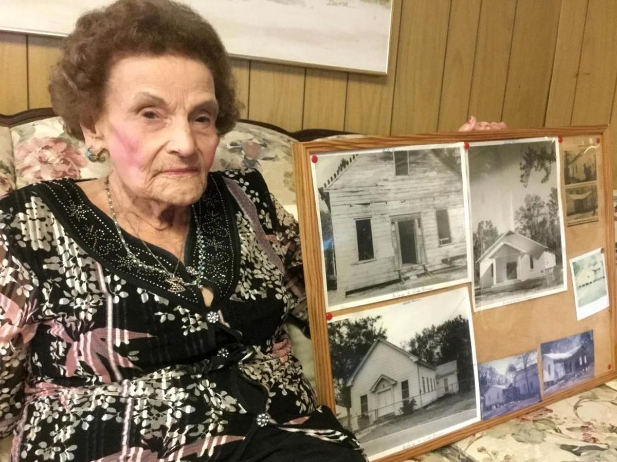 Linda Farmer holds a picture frame made by her late husband, Alton, that shows the different buildings of Indian Hill Baptist Church as she sits in her home on Wednesday, Aug. 30, 2017, in Bluffton, S.C.