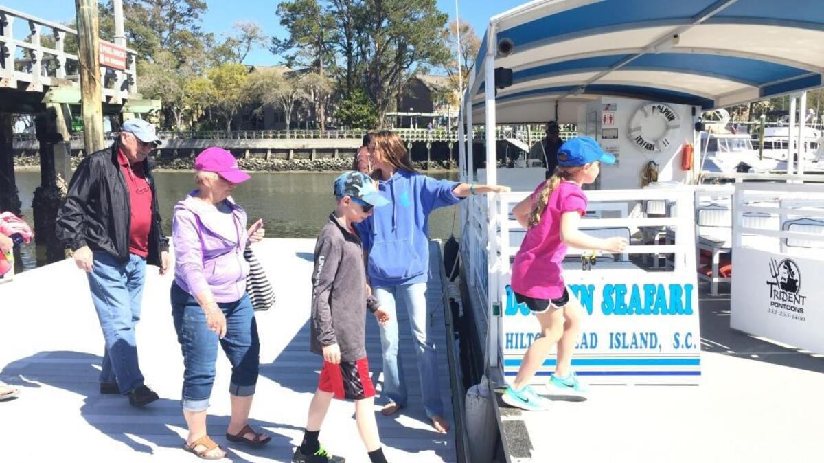 A group loads onto Dolphin Seafari Thursday morning.