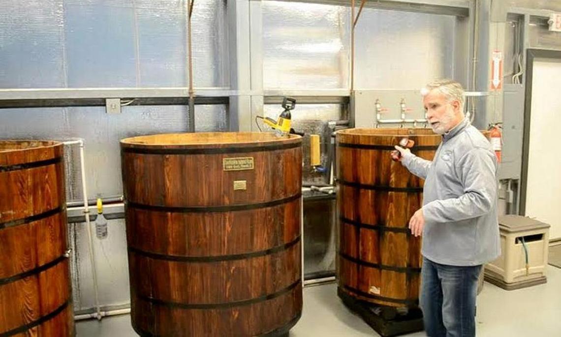 Tony Chase, owner of Daufuskie Island’s Rum Company, holds a bottle of one of his products.