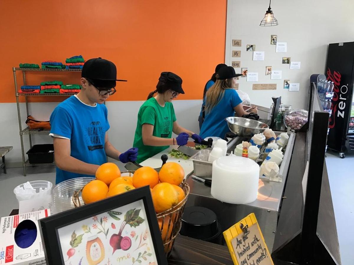 Employees at the Healthy Habit restaurant at 55 Mathews Drive on Hilton Head Island prepare chopped salads, juices and smoothies.
