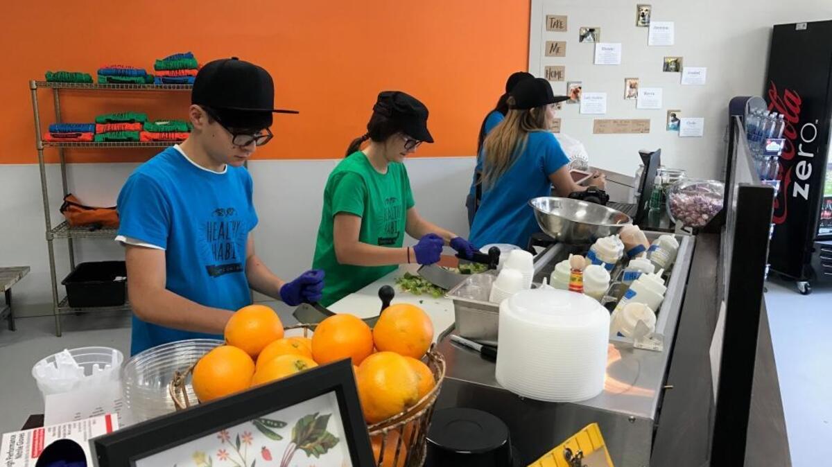 Employees at the new Healthy Habit restaurant at 55 Mathews Drive on Hilton Head Island prepare chopped salads, juices and smoothies.