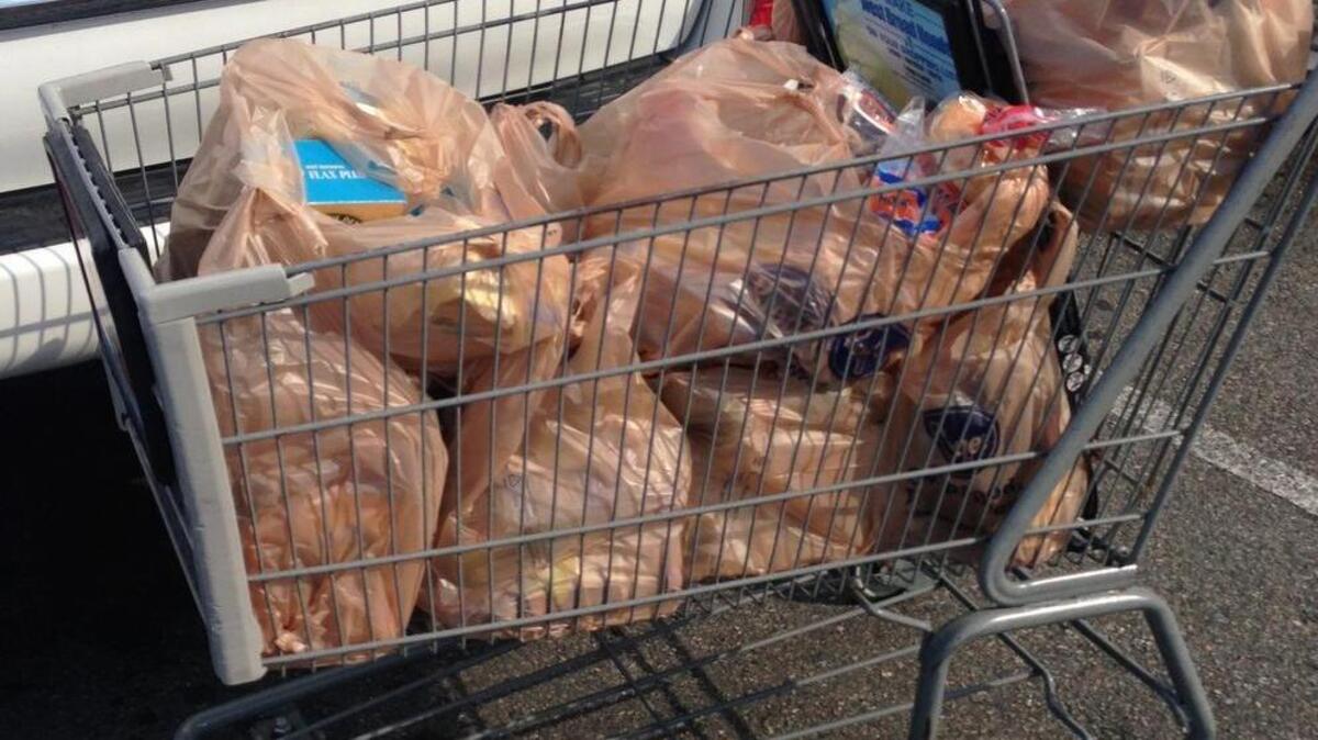Stock photo of plastic bags in a grocery cart.