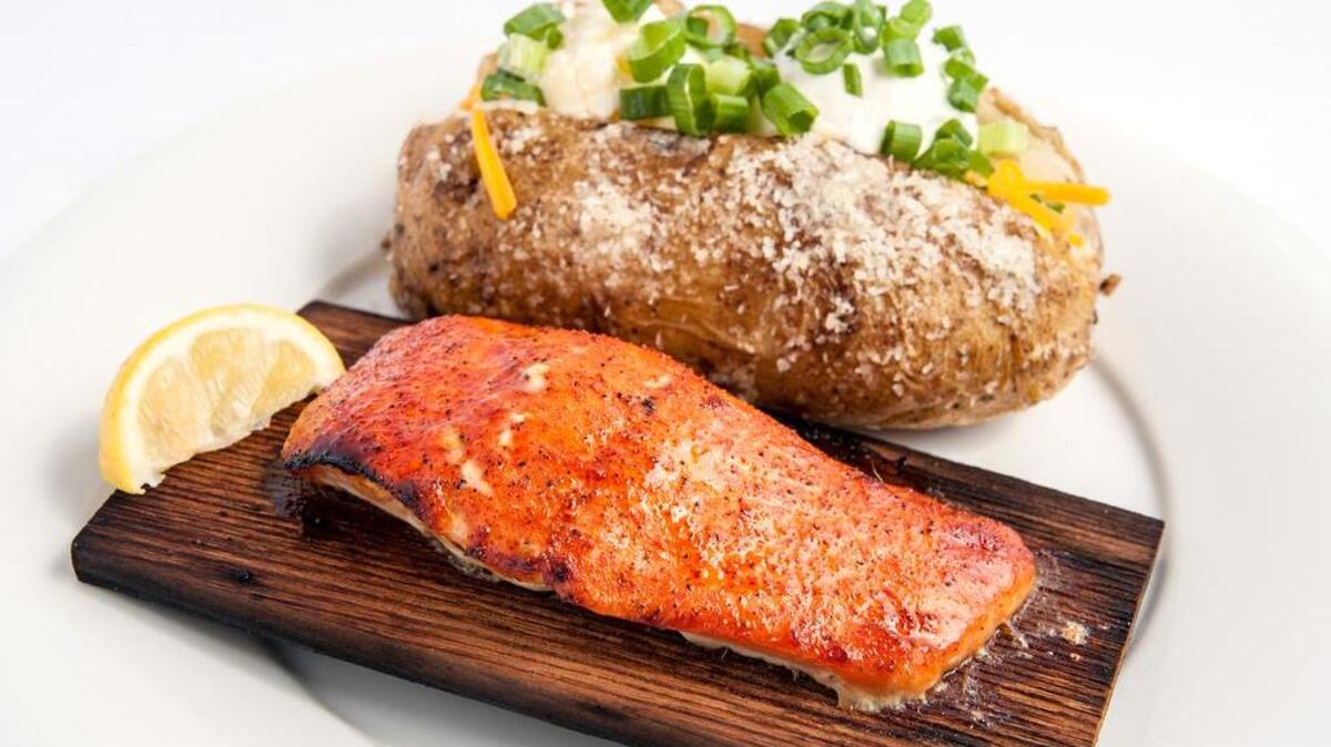 Cedar plank salmon from Hickory Tavern, which opens March 16 on Hilton Head Island.