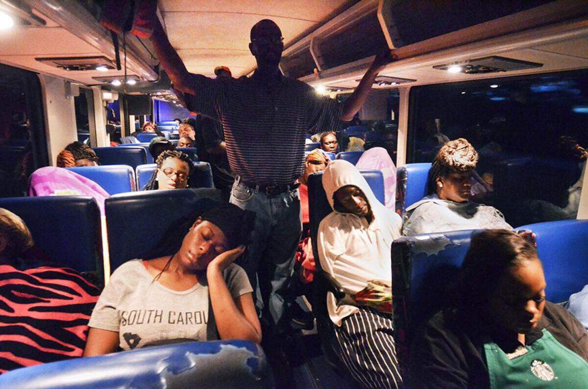 Palmetto Breeze riders fortunate enough to be seated — including Laquia Paterson, foreground, left — sleep during their July 27, 2016, pre-dawn bus ride from Allendale to Bluffton and Hilton Head Island. Paterson was going to a job interview at Disney’s Hilton Head Island Resort.