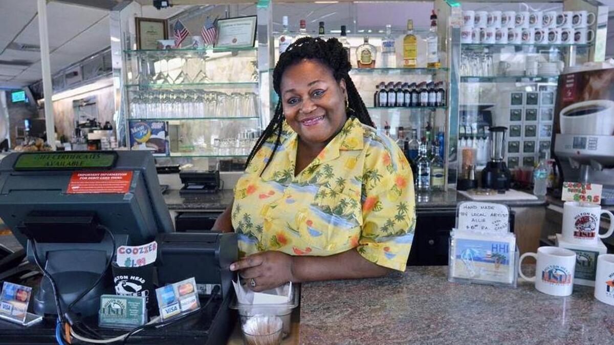 Daraleen Webber is photographed behind the counter at Hilton Head Diner, where she has worked while bringing up four children as a single mother. Jay Karr jkarr@islandpacket.com