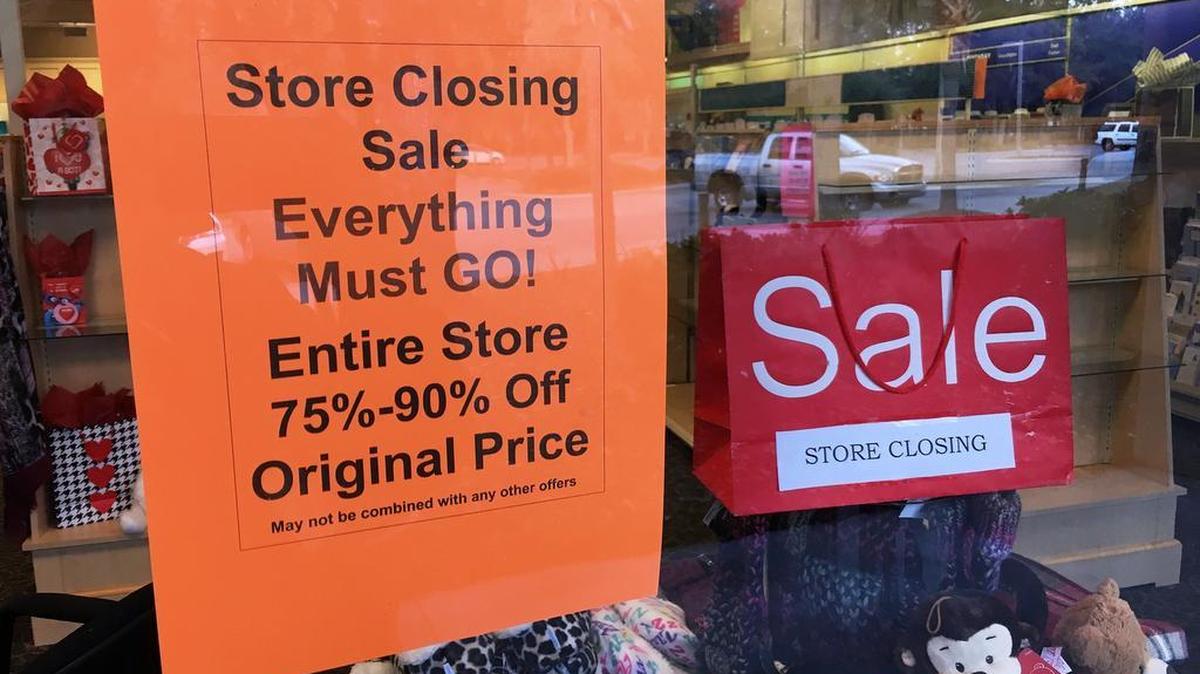 Signs in the front window announce the store closing sale at the Hallmark store at Hilton Head’s Shoppes at Indigo Run on Monday. Both this store and another in Bluffton will be closing.