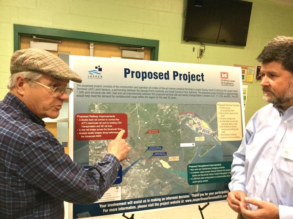 FILE PHOTO: Joseph Harrison, of Hardeeville, left, talks with Nat Ball, a project manager with the U.S. Army Corps of Engineers, Charleston District, about the proposed Jasper Ocean Terminal during an open house to discuss the port Tuesday night at Hardeeville Elementary School.