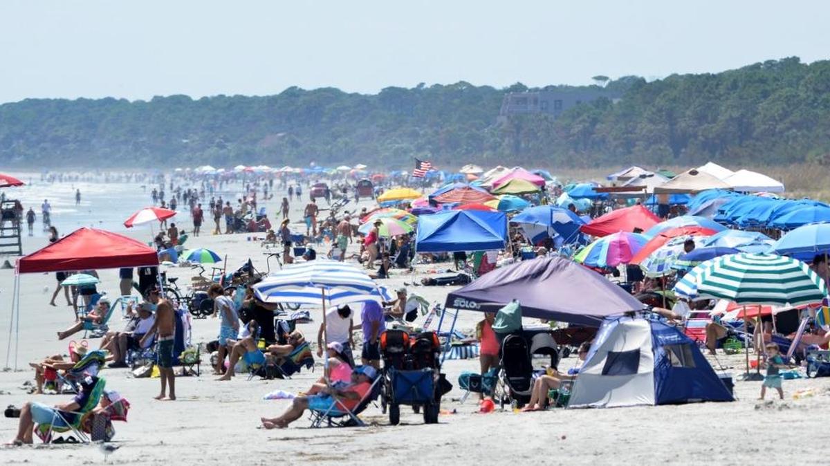 In this file photo, Labor Day beachgoers line the shore in this view looking down South Forest Beach toward Sea Pines on Hilton Head Island.