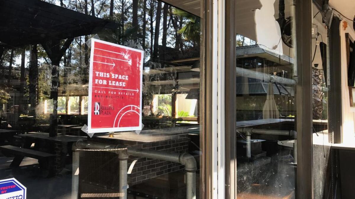 A sign is posted in the window of the old Hilton Head Brewing Company Pub, which closed at the end of the year.
