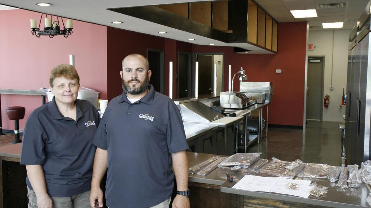 Co-owners and extended family Marcie Bindes, left, and Adam Markowitz pose in front of their soon to open franchise Charlie Graingers. The duo expects to have their grand opening on Sept. 3, 2016 and will be one of the first ten franchises to open of more than 50 that have been sold in South Carolina and several other states. The restaurant specializes in grab and go foods including hotdogs, brisket and barbeque.
