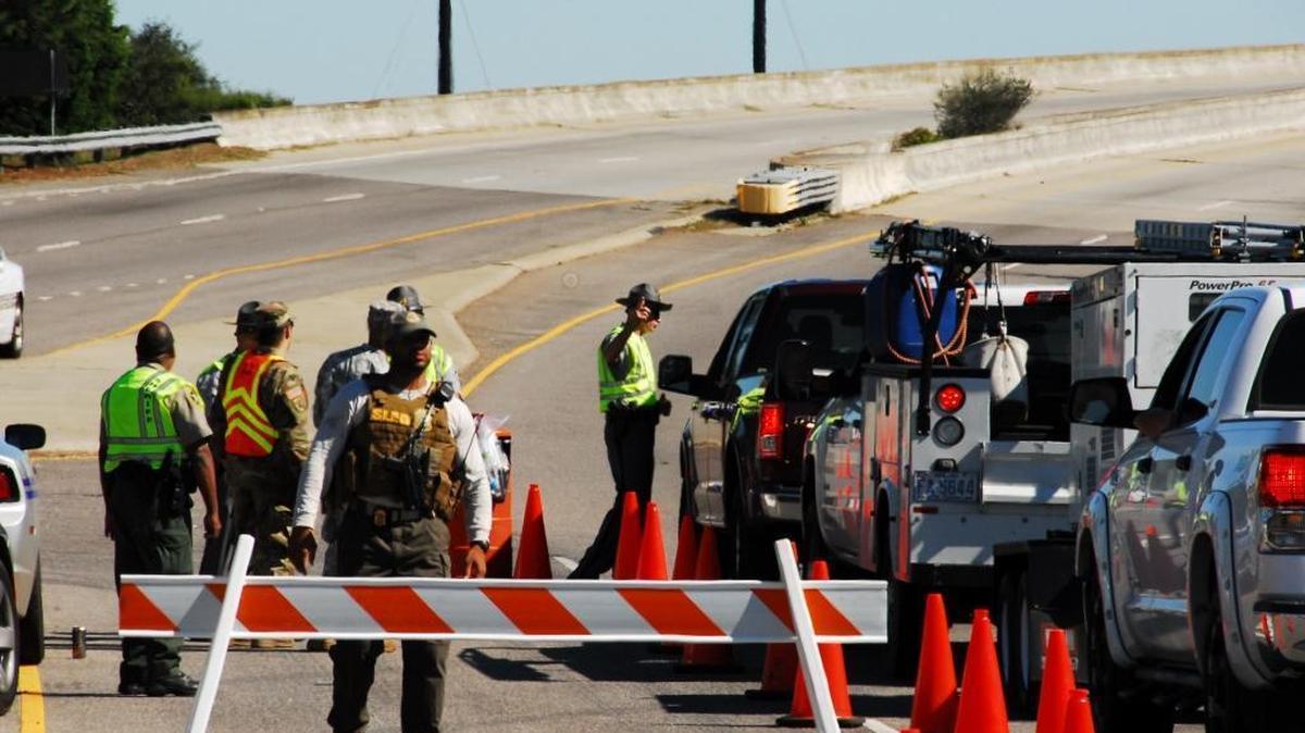 The line to get onto Hilton Head was relatively short and fast-moving on Monday afternoon, with officers waving in only those with emergency management credentials, a re-entry pass — called a green card — or contract work to remove debris and fix damage.