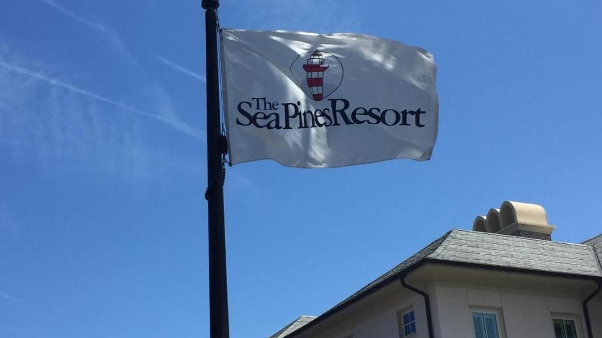 An executive at the Sea Pines Resort in Hilton Head has been put on administrative leave following his arrest for assault at a Disney hotel.