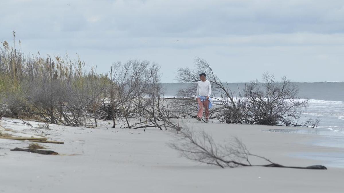 Bay Point Island manager and trustee Ned Tupper walks along the island’s beach on Sept. 22, 2016.