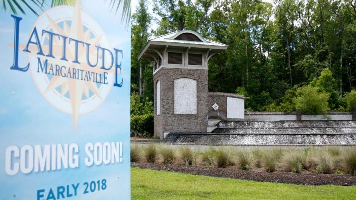 The signage on the cascading waterfall, as seen on Thursday, May 25, 2017, that once announced to visitors that they were entering Hilton Head Lakes has been removed and replaced with a sign announcing the proposed Latitude Margaritaville housing community for residents 50 and older.