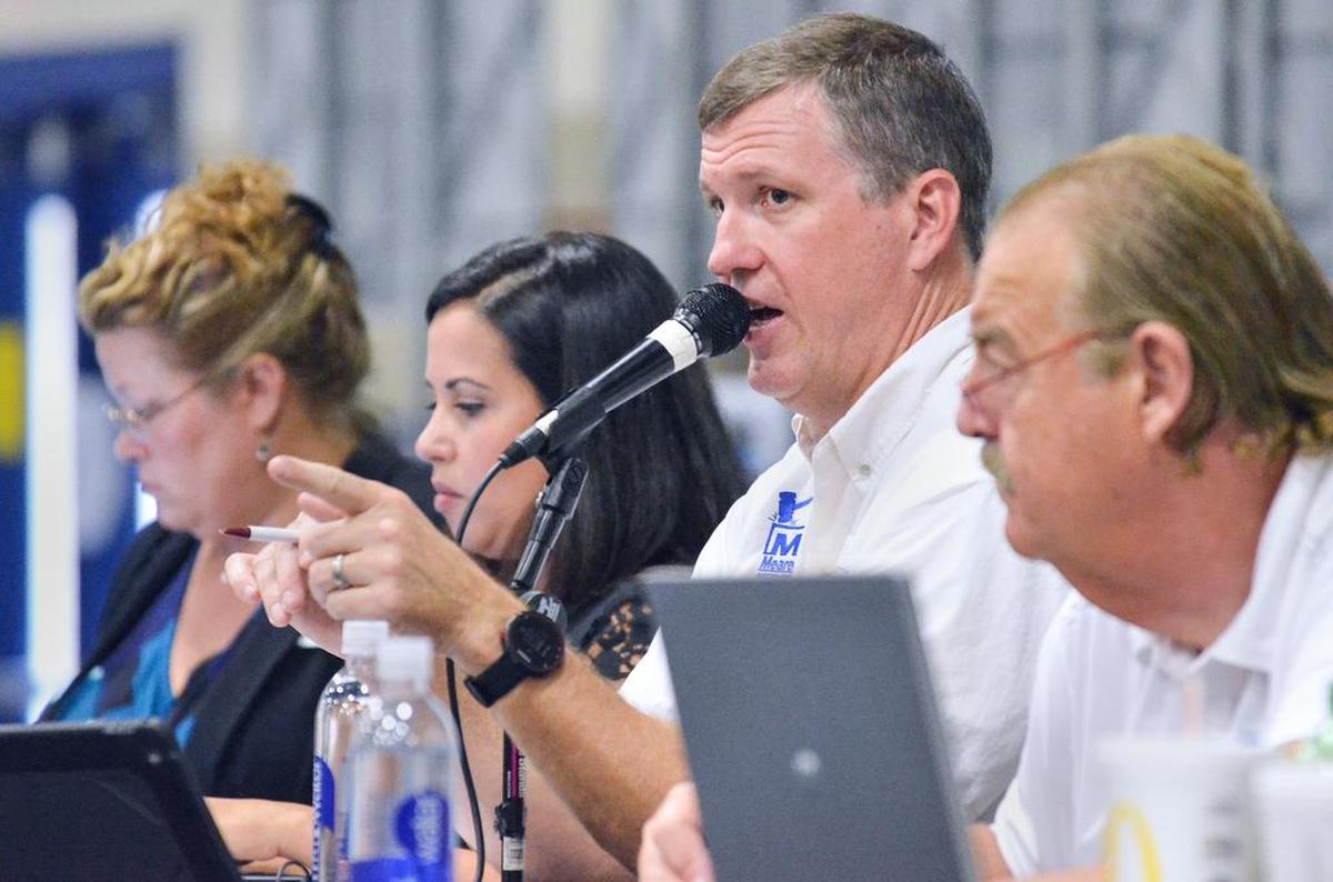 Auctioneer Darron Meares, of Meares Auction Group out of Greenville, acknowledges a bidder during the Beaufort County Tax Sale on Monday, Oct. 3, 2016.
