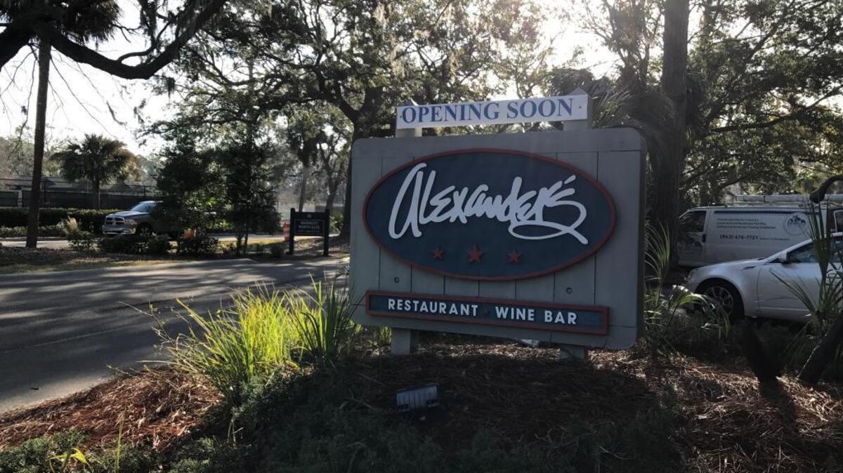 A banner that reads “Opening Soon” appeared above the sign of Alexander’s, which closed in preparation of Hurricane Matthew.