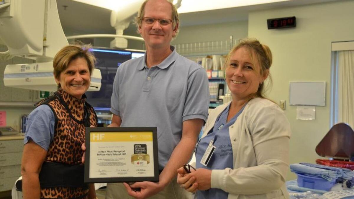 Pictured (left to right) are members of Hilton Head Hospital’s Cath Lab, April Van Name, Dr. Calvin Sharp and Rhonda Johnson. The hospital recently received the “Get With The Guidelines® – Heart Failure Gold-Plus Quality Achievement Award.”