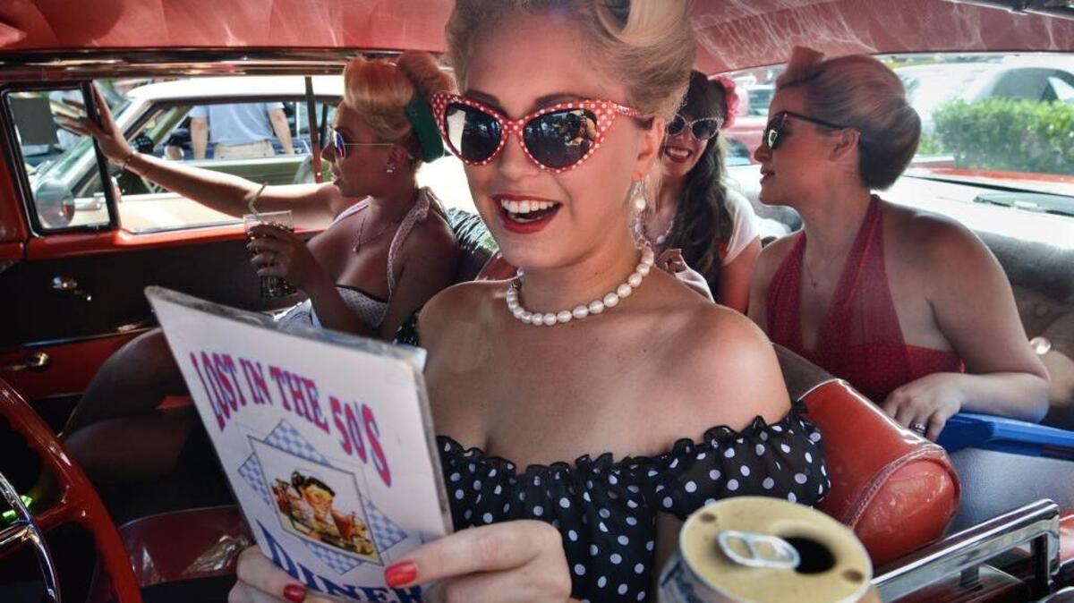 Kate Delay and fellow members of the Hilton Head Ice Cream Girls -- dressed up to raise funds for the fight against cancer -- looked right at home in cancer survivor Harry Walker's matador red 1957 Chevy Bel Air at the First Annual Hilton Head Cars Against Cancer event at South Island Square. The car show was held to support organizations that raise awareness about and provide treatment services for the fight against cancer, especially liposarcoma. Cars Against Cancer is a charitable fund of the Community Foundation of the Lowcountry.
