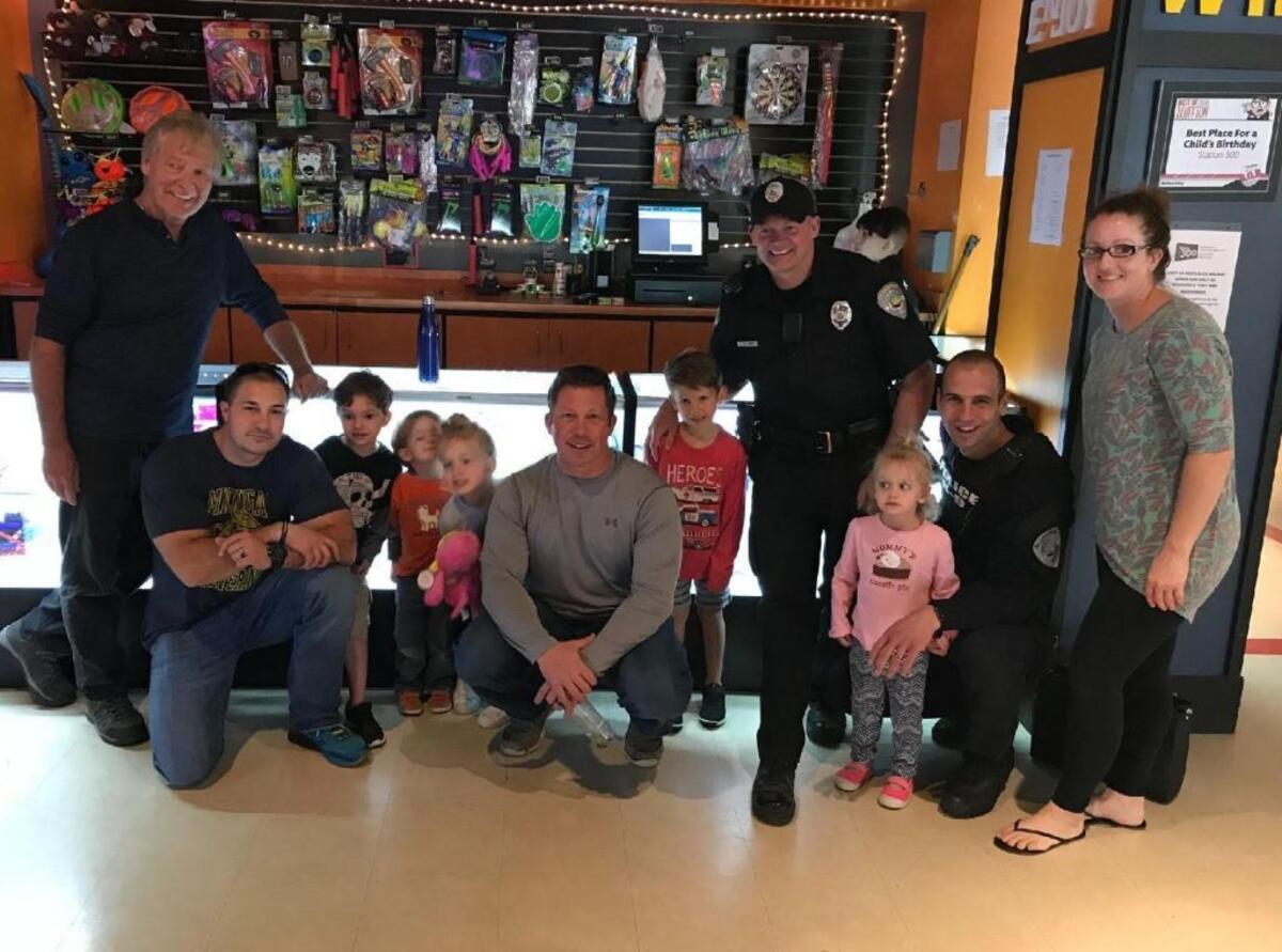 Members of the Bluffton Police Department and their families gathered at Station 300 on Saturday to allow Jana Bates some quiet time to rest. L to R - Jana's dad, Mike, Officer Karafa (kneeling), Captain Babkiewicz (middle kneeling gray longsleeve), K-9 Officer Grant (uniform & wearing the hat) and K-9 Officer DeCrane and Ashley Chandler (wife of Lt. Scott Chandler) with their children, treated Ryan Bates and Logan Bates to a fun afternoon of bowling, arcade games, ice cream followed by a trip to the park.