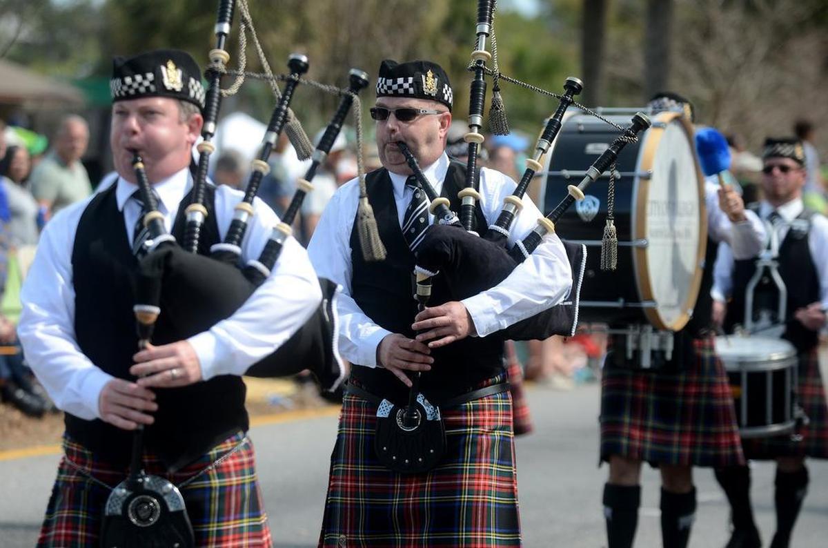 A bagpiper with the Wake & District Public Safety Pipes and Drums out of Raleigh, N.C., plays while marching in the Hilton Head Island St. Patrick’s Day Parade on Sunday, March 13, 2016, along Pope Avenue on Hilton Head.