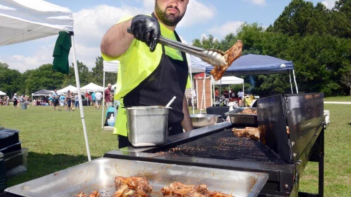 Randy Aleman with Marley’s Island Grille cooks up a batch of mesquite wood-fired jerk ribs during a previous year’s Rib Burnoff and Barbecue Fest sponsored by the Kiwanis Club of Hilton Head. This year’s festival has been canceled.