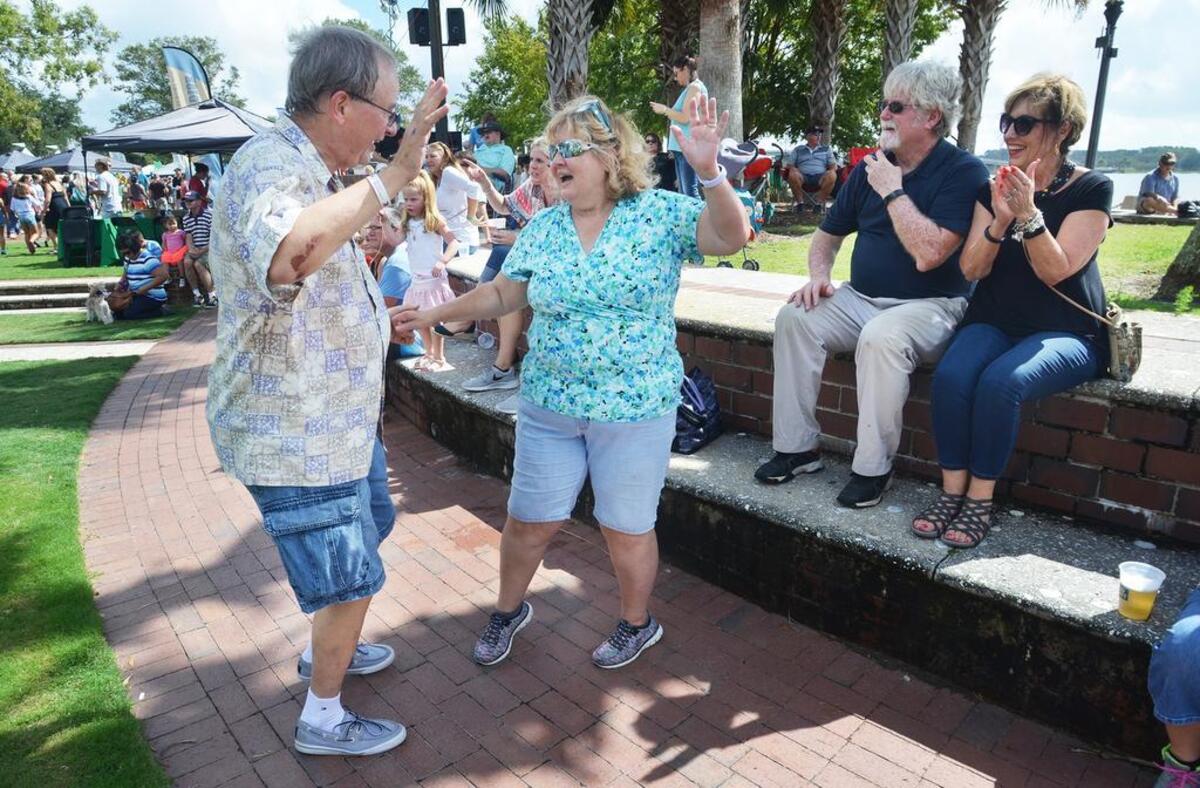 Matt and Norma Dudzinski, visiting from Virginia, dance to the music of the Debbie McDaniel Band during the 23rd annual Beaufort Shrimp Festival on Saturday at Henry C. Chambers Waterfront Park.