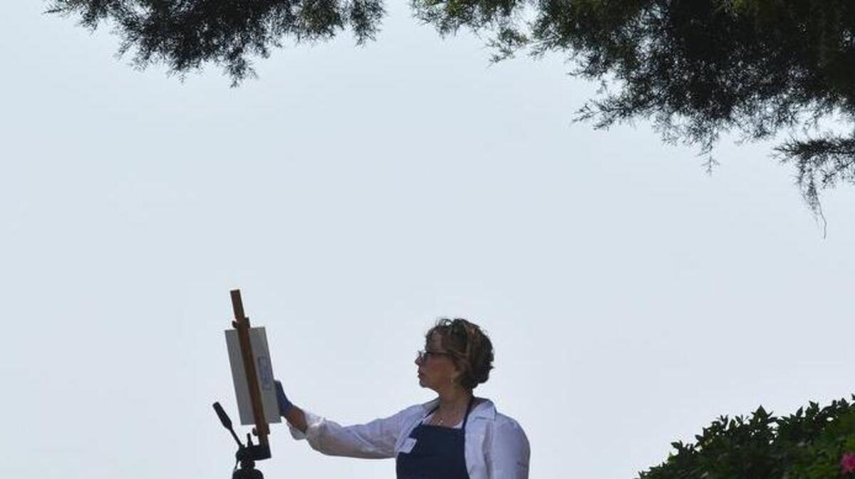 Artists of all types converged on Bluffton last year to create landscape paintings of scenic Old Town for the Bluffton Arts District’s inaugural Bluffton Old Town Paint Out. Here, Bluffton’s Linda Nickles works on an oil painting of the Church of the Cross.