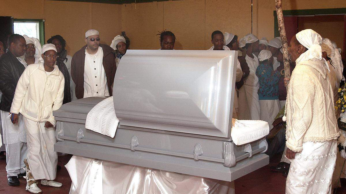 Mourners gather to pay their last respects to Chief Priest Adenibi Edubi Ifamuyiwa S. Ajamu on Saturday morning at the Oyotunji African Village in Sheldon. Ajamu was one of the founding fathers of village.