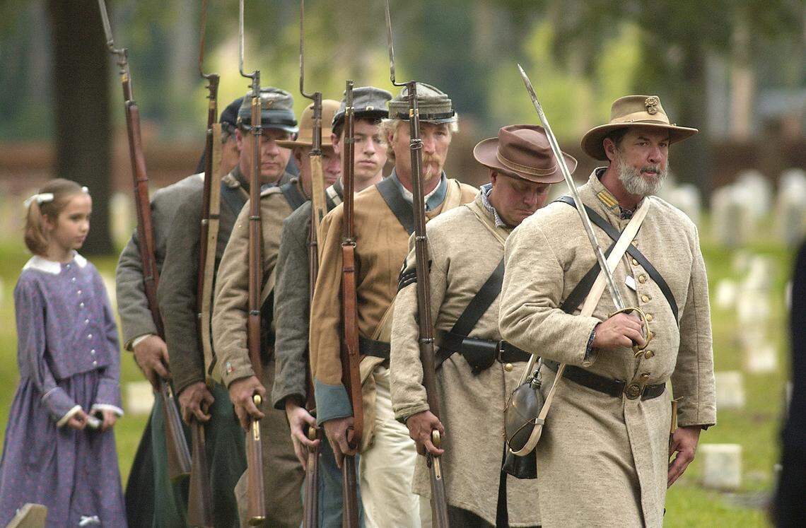 Civil War reenactors from the 11th South Carolina Volunteer Infantry march in formation as they post the colors during Confederate Memorial Day in 2010 at the Beaufort National Cemetery. There are 117 Confederate soldiers buried in the cemetery.